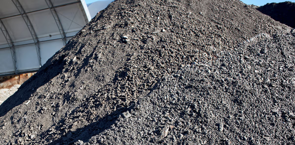 German researchers develop process to permanently bind CO2 using incinerator bottom ash, creating material that can replace sand/gravel in road construction or act as binder in concrete production, advancing circular economy and low-carbon construction materials.